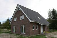 Haustyp Westfalen, Klassisches Massivhaus in NRW, Geothermie / Tiefenbohrung für Erdwärmepumpe, Dreieckgaube, Dreieckfenster